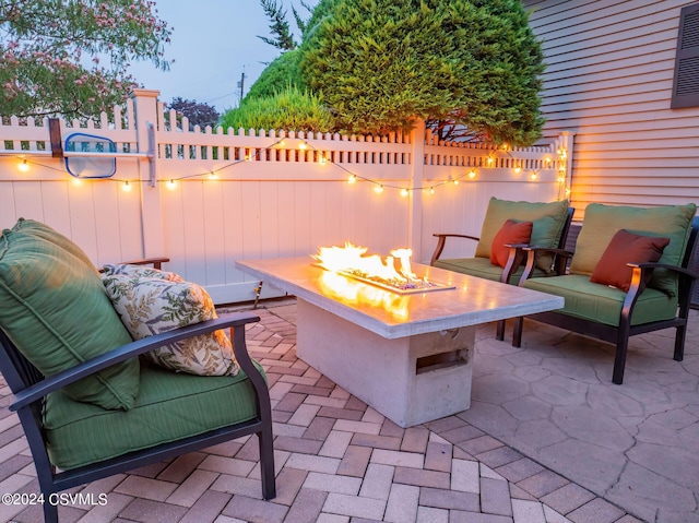 patio terrace at dusk with an outdoor fire pit