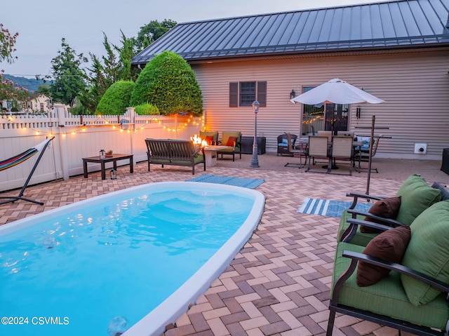 view of pool featuring a patio