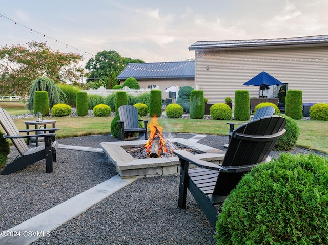 view of patio / terrace with an outdoor fire pit