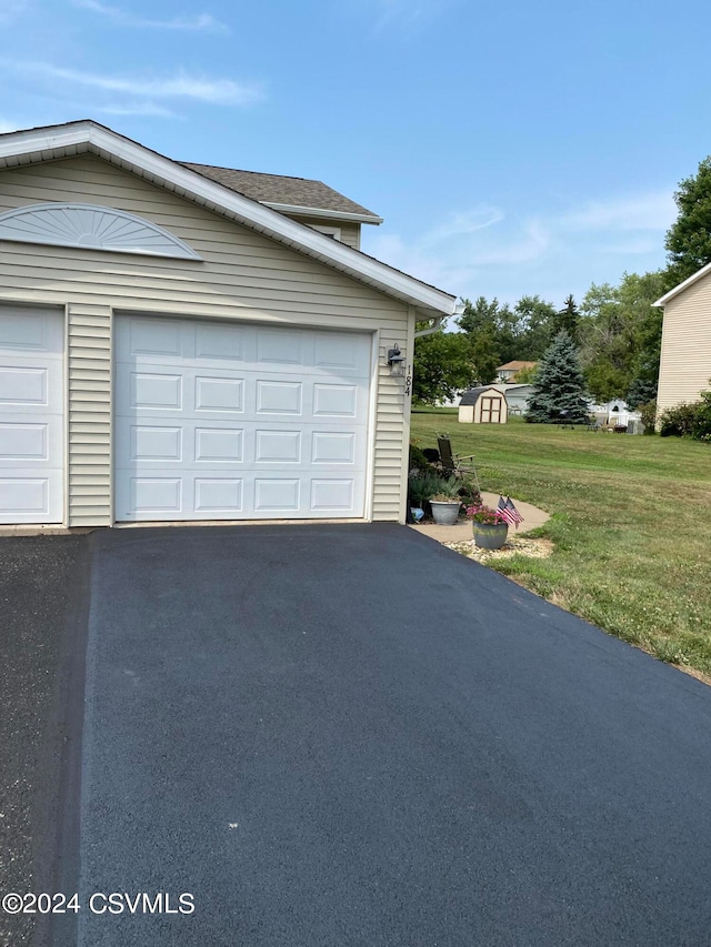 garage with a lawn