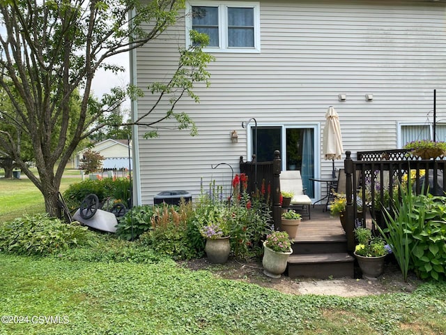 back of property featuring a wooden deck