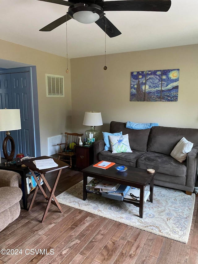 living room with ceiling fan and wood-type flooring