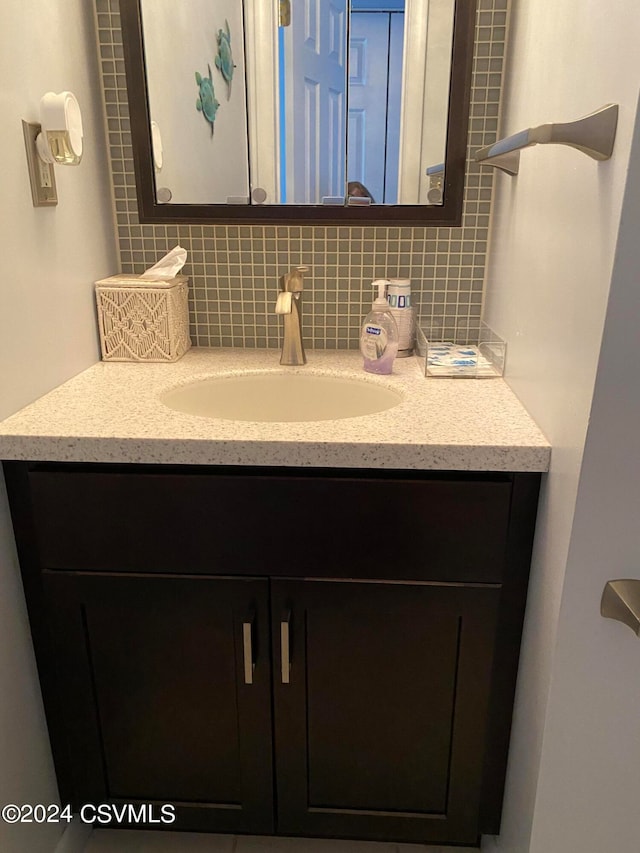 bathroom with backsplash and vanity