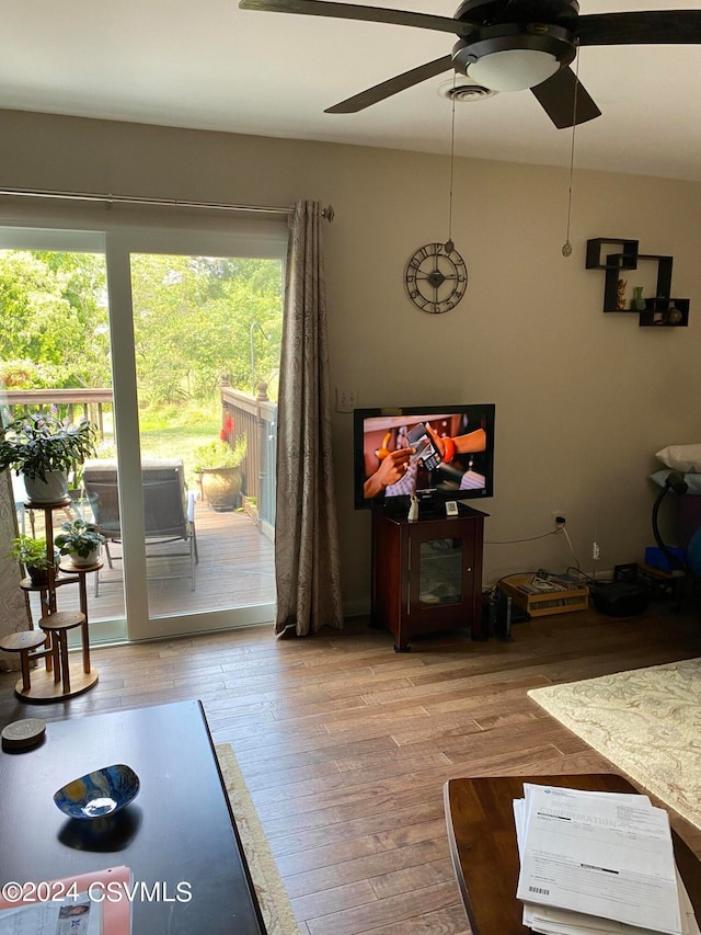 dining space featuring ceiling fan and hardwood / wood-style floors