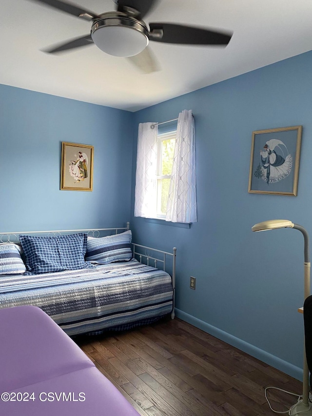 bedroom with ceiling fan and wood-type flooring