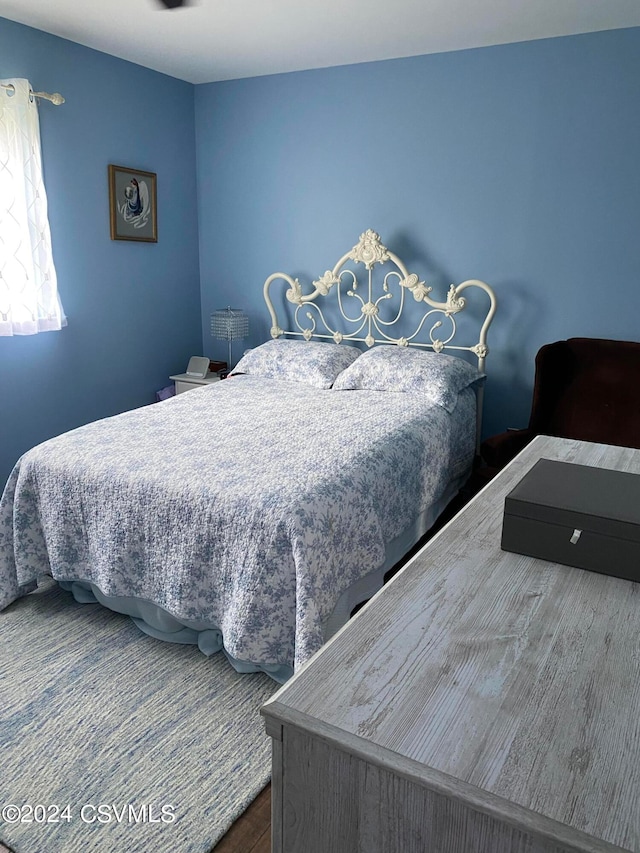 bedroom featuring hardwood / wood-style floors