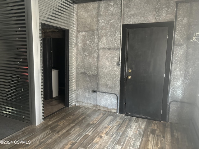 empty room featuring dark hardwood / wood-style flooring