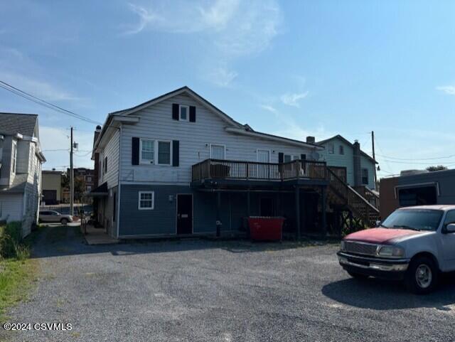 view of front of property with a deck