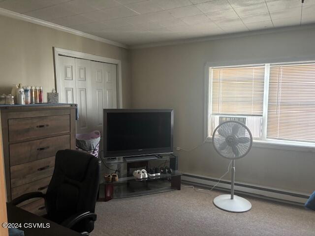 office area featuring carpet floors, crown molding, and a baseboard radiator