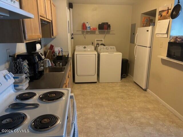 kitchen with white appliances and electric panel