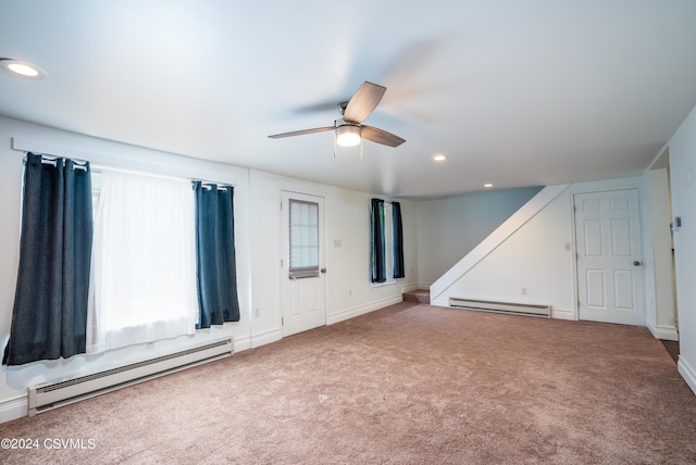 spare room with a baseboard radiator, carpet, and ceiling fan