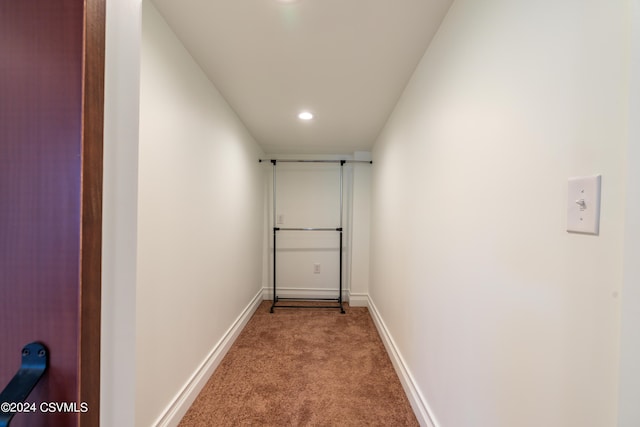 hallway with light carpet