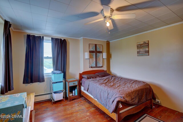 bedroom with ornamental molding, ceiling fan, and hardwood / wood-style floors