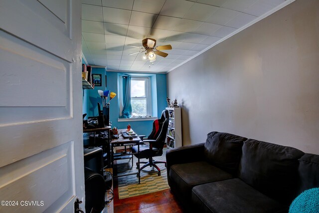 home office featuring ornamental molding, ceiling fan, and hardwood / wood-style floors