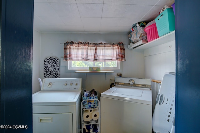 clothes washing area with washer and dryer