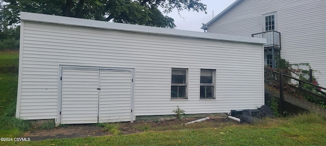 view of home's exterior with a storage shed