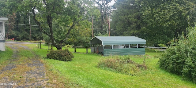 view of yard with a carport