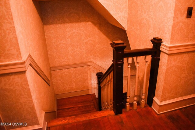 stairs with wood-type flooring