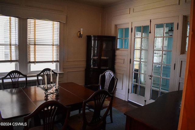 dining space with hardwood / wood-style floors