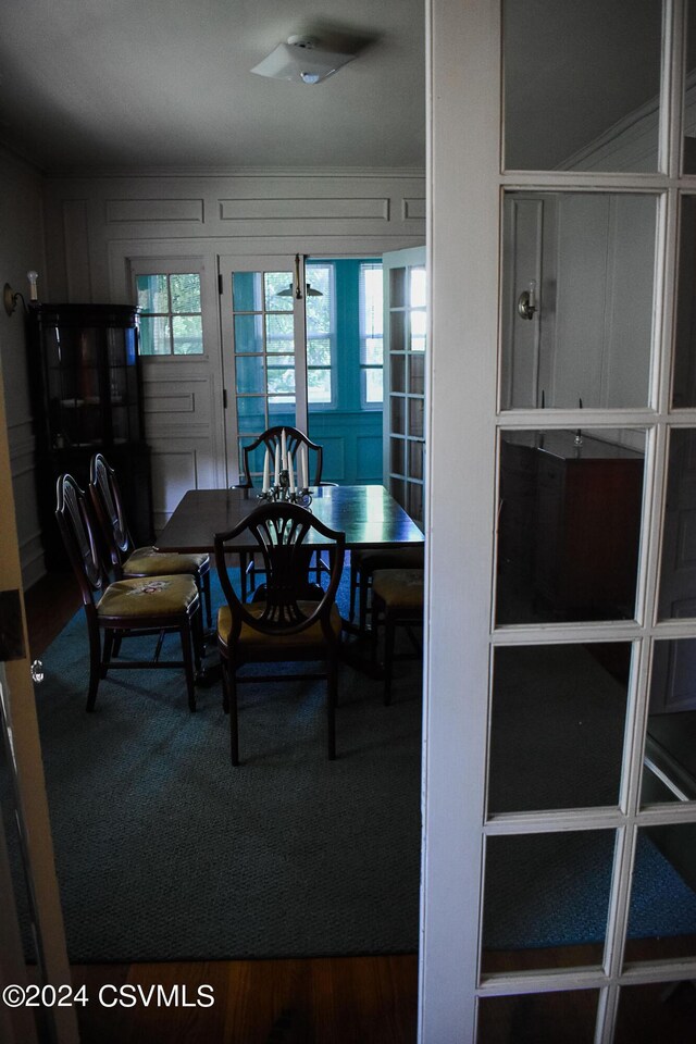 dining area with hardwood / wood-style floors