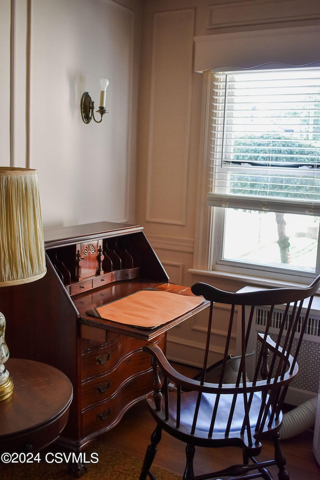 dining space with hardwood / wood-style flooring