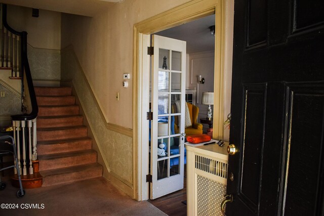 stairs with wood-type flooring