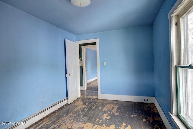 empty room featuring a baseboard radiator