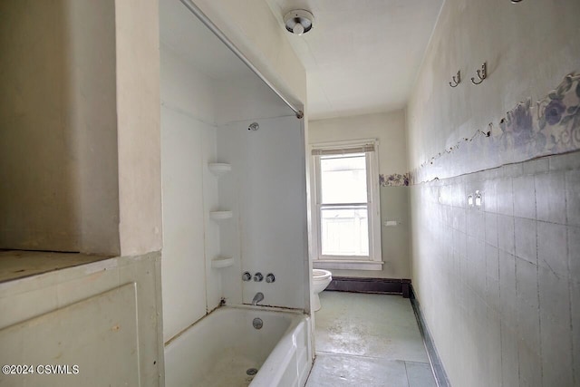 bathroom featuring shower / bath combination, toilet, and tile patterned flooring