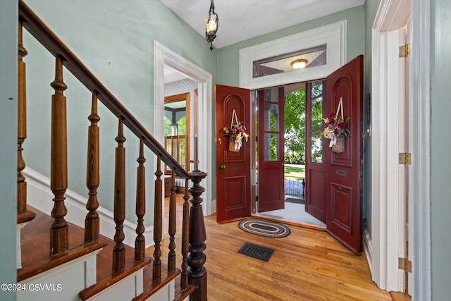 foyer with a wealth of natural light and light wood-type flooring