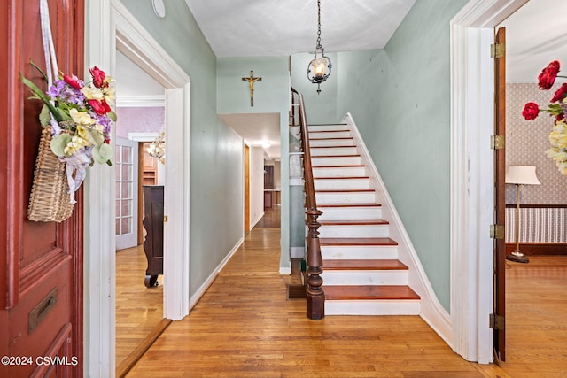 stairs featuring hardwood / wood-style floors