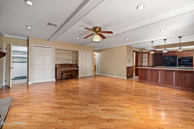 unfurnished living room with light hardwood / wood-style flooring, ceiling fan, and beamed ceiling