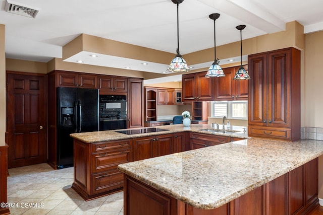 kitchen with sink, decorative light fixtures, light tile patterned floors, kitchen peninsula, and black appliances