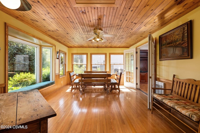 dining area featuring wood ceiling, ceiling fan, and light wood-type flooring