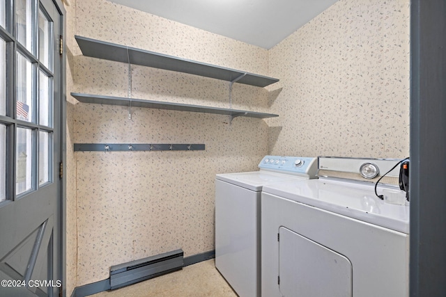 washroom with washing machine and clothes dryer