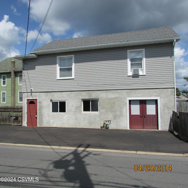 view of side of home featuring cooling unit