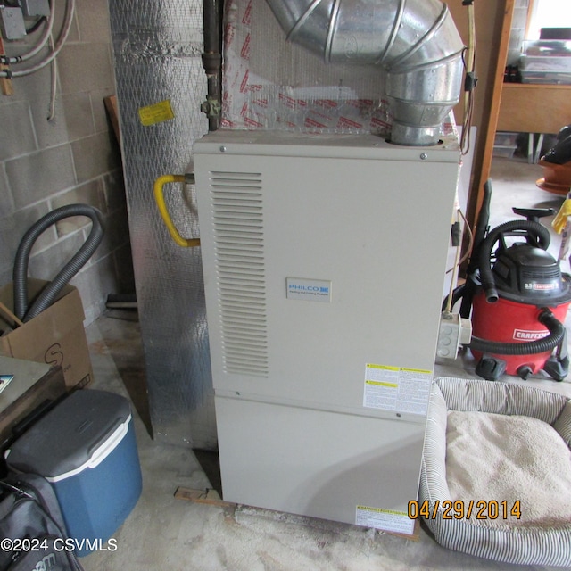 utility room with heating unit