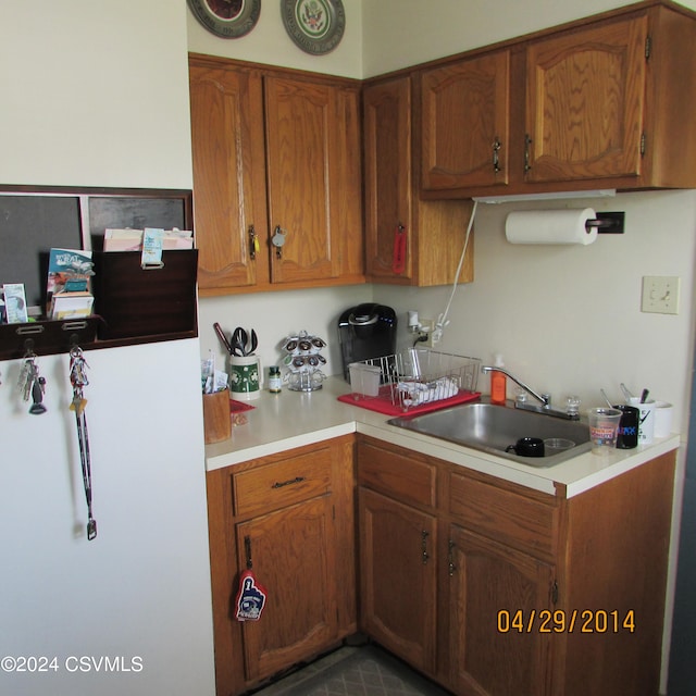 kitchen with sink and refrigerator