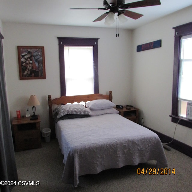 carpeted bedroom featuring ceiling fan