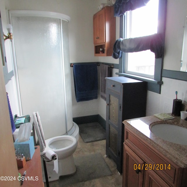 bathroom with tile patterned floors, vanity, and toilet