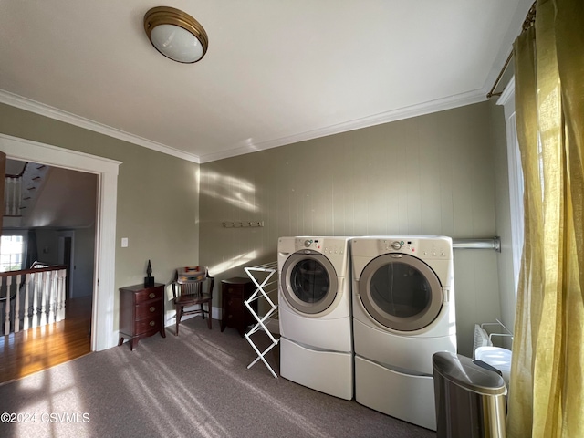 clothes washing area featuring washer and dryer, carpet, and ornamental molding