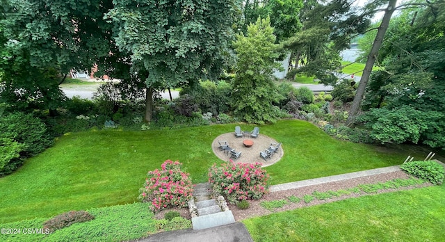 view of yard with a water view and a patio