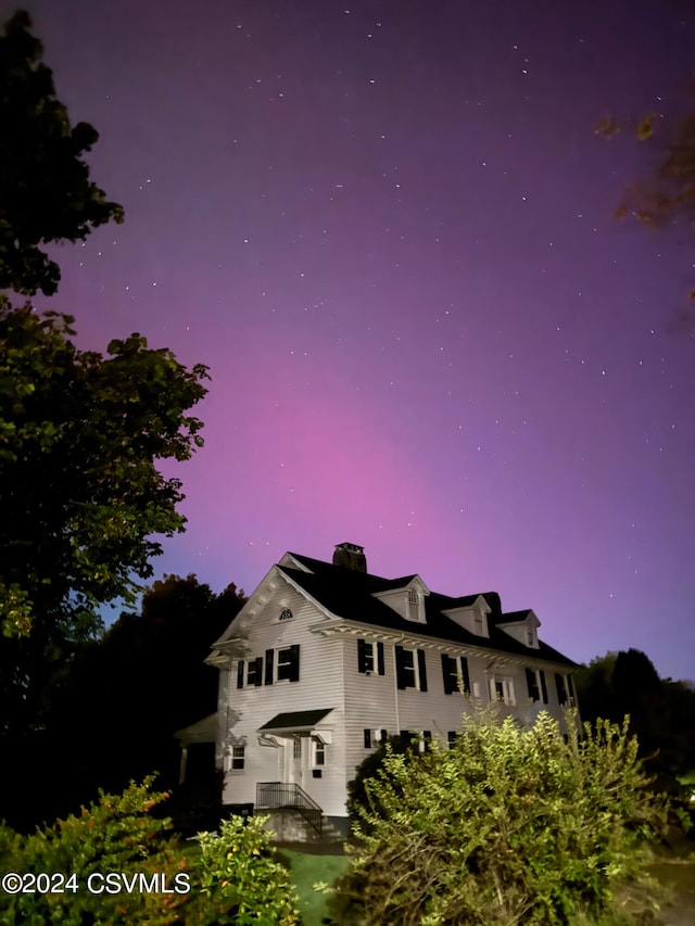 view of property exterior at dusk