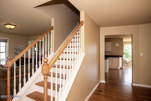 stairway featuring hardwood / wood-style flooring