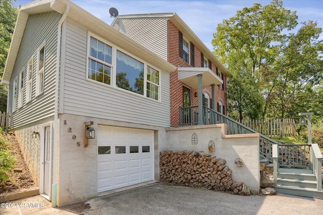 view of side of property with a garage