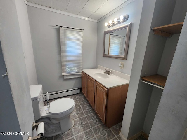 bathroom with vanity, baseboard heating, tile patterned floors, and toilet