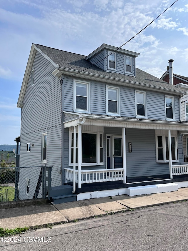 view of property with covered porch