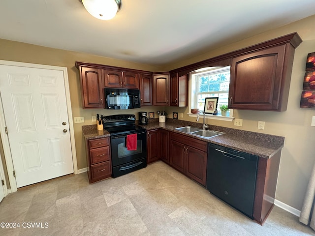 kitchen with black appliances and sink