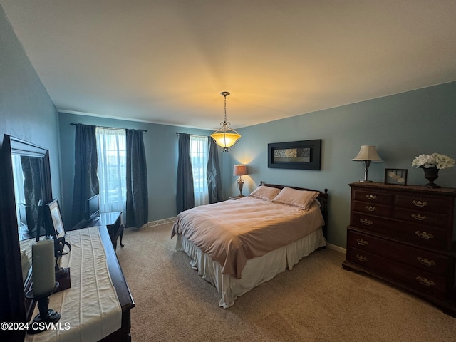 bedroom featuring light carpet