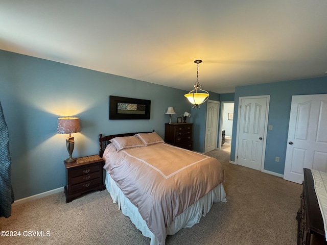 bedroom featuring light colored carpet