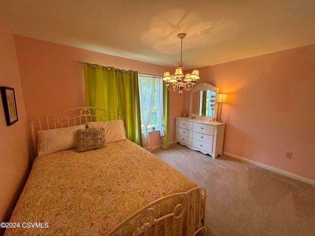 carpeted bedroom with an inviting chandelier